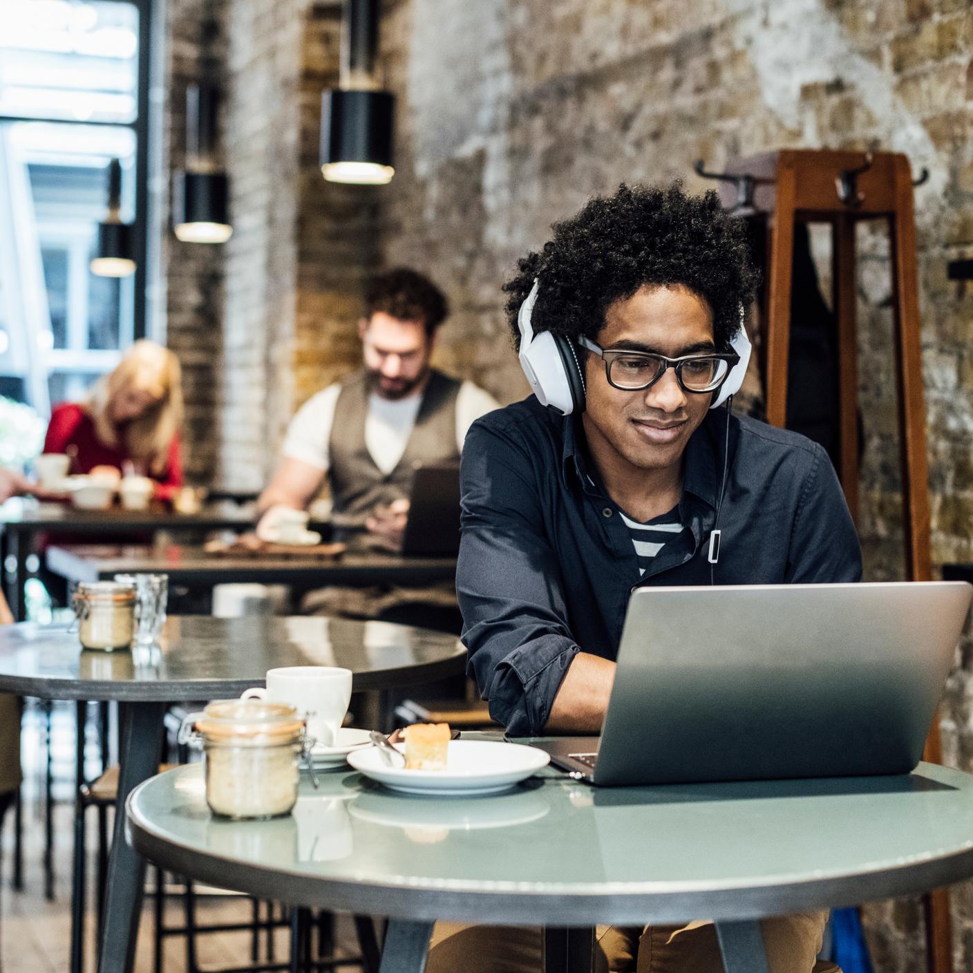 Lady in coffee shop on laptop 
