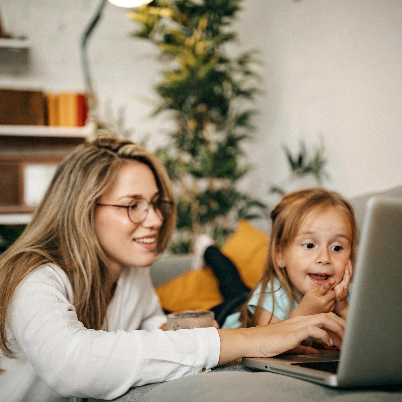 Mum and daughter viewing laptop 