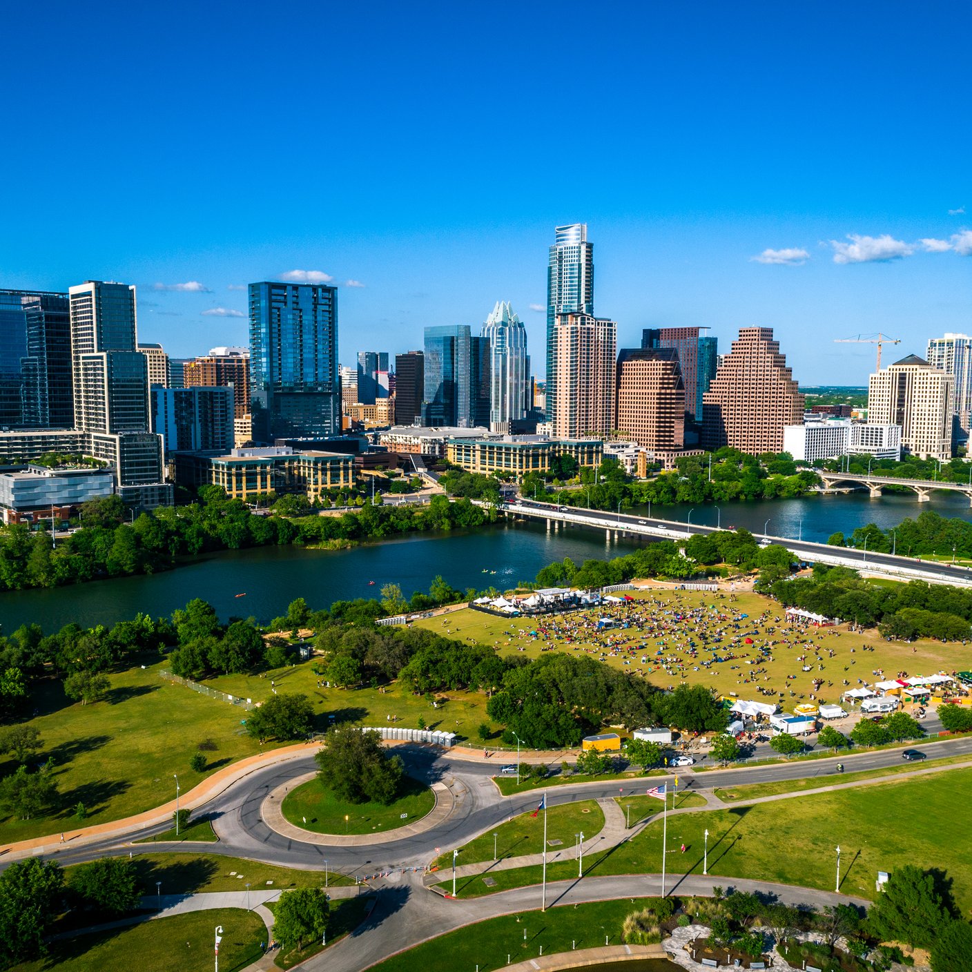Austin Texas summer time 2019 aerial drone view above downtown skyline cityscape capital city of Texas with large crowd below..