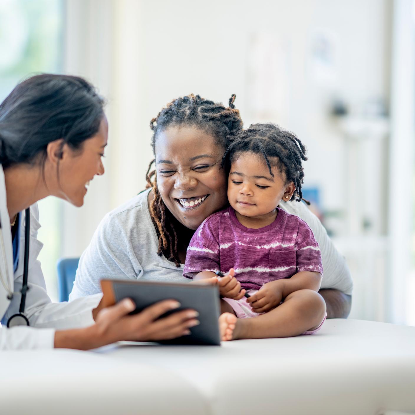 Young mother and her son visit the doctor