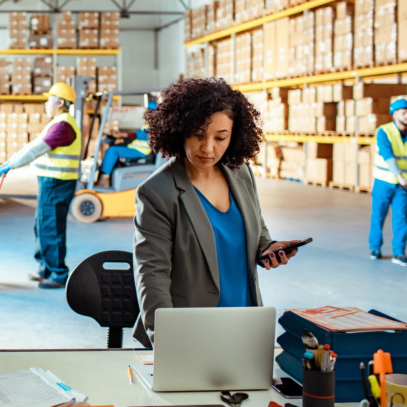 women on laptop in factory 