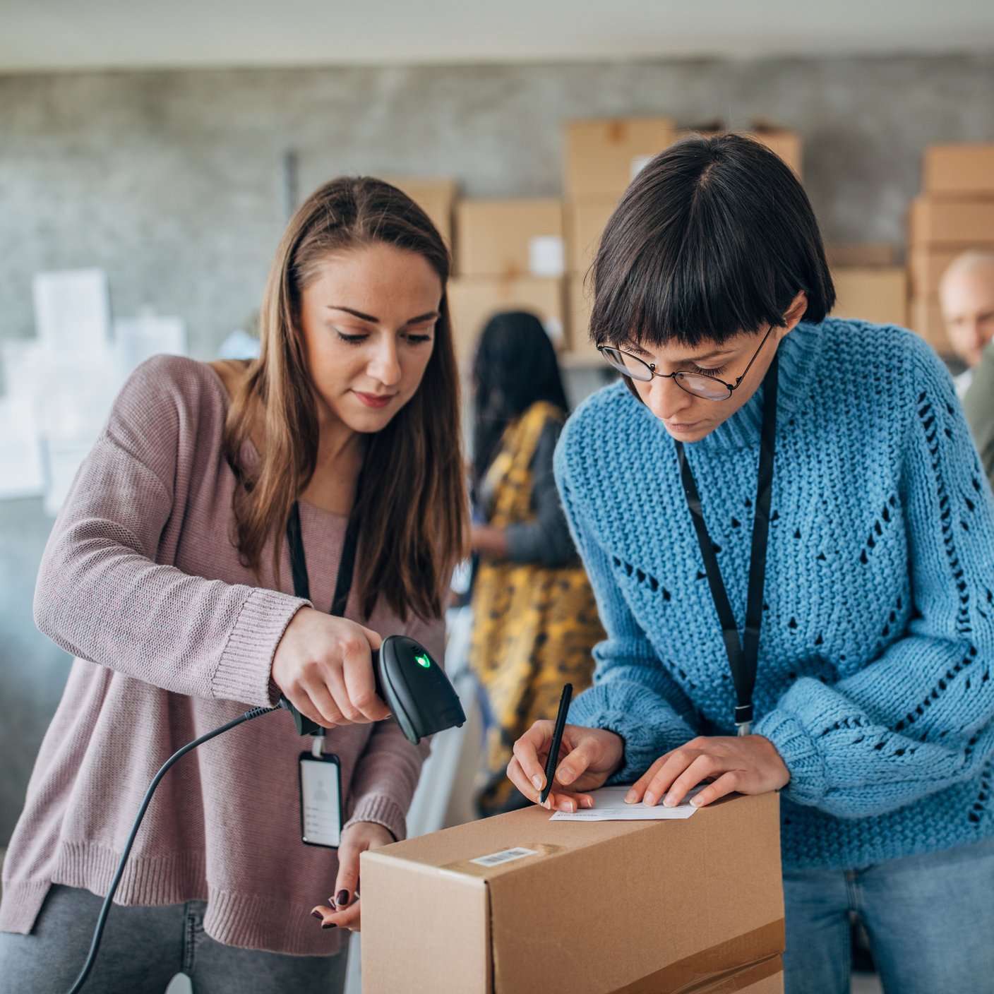 People working in a warehouse.