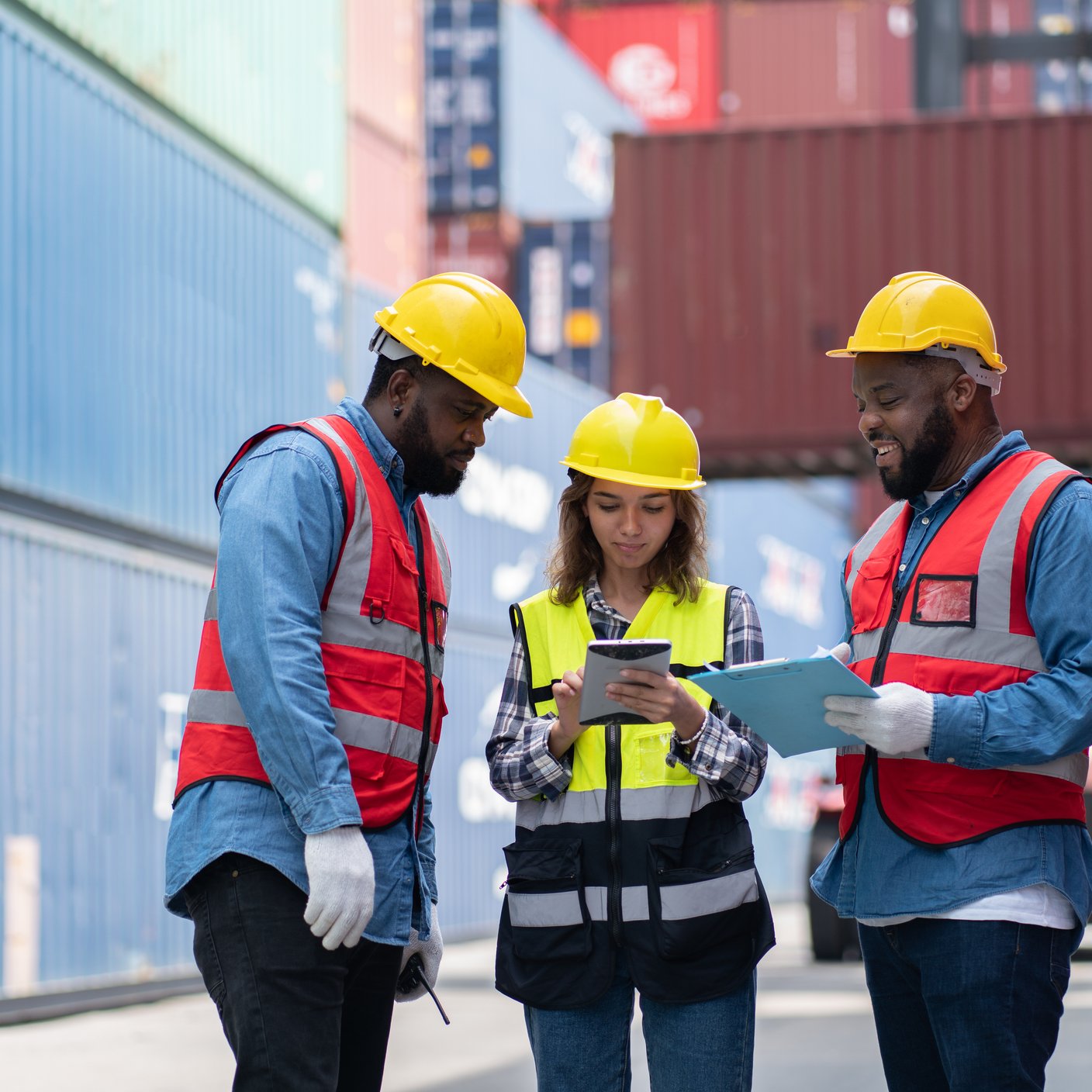 man and woman business engineer in container transportation industry.Shipping Container Distribution Warehouse Technology.Foreman meeting teamwork at the construction industry.