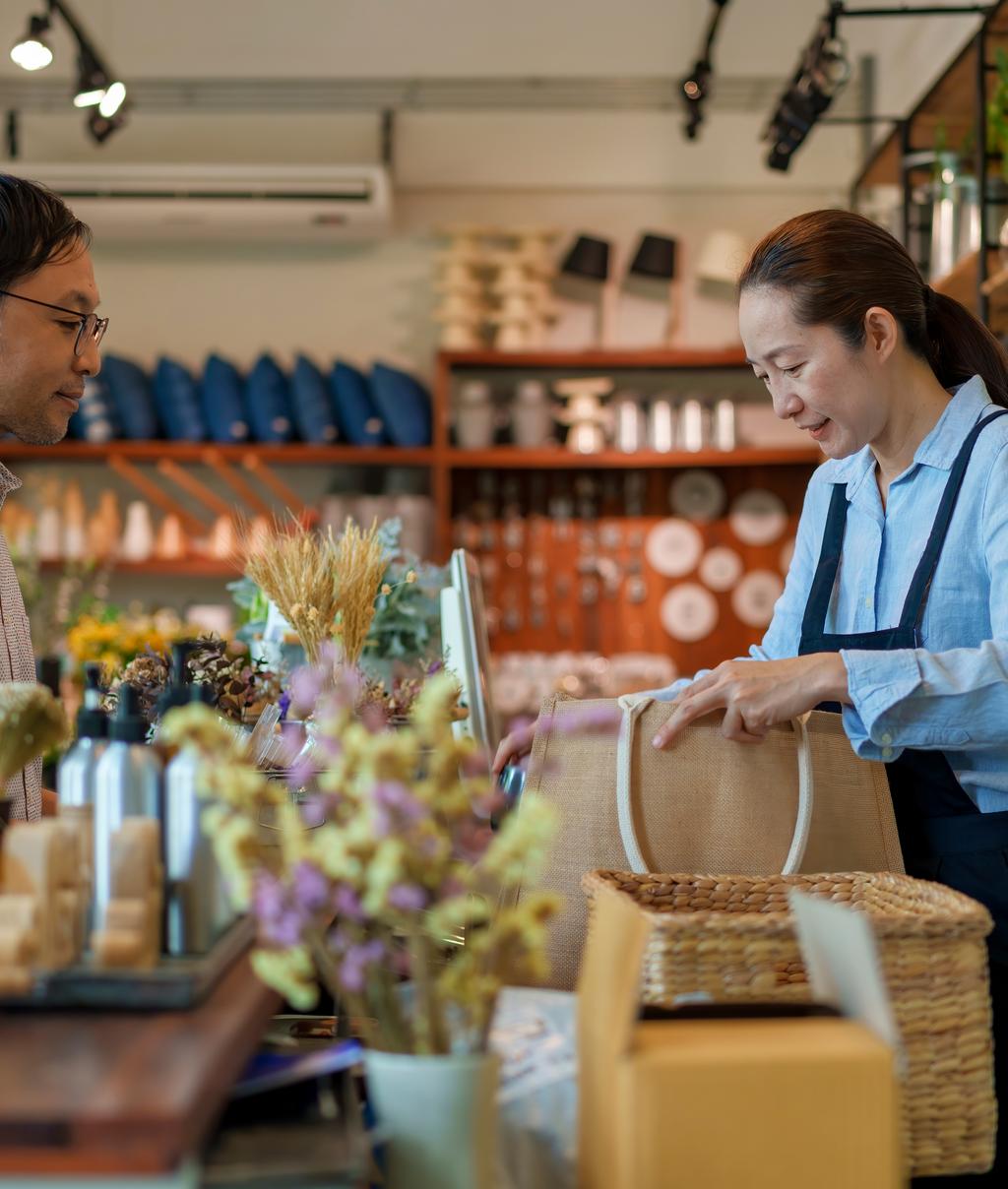 Sustainability in manufacturing - man at counter in home decor store