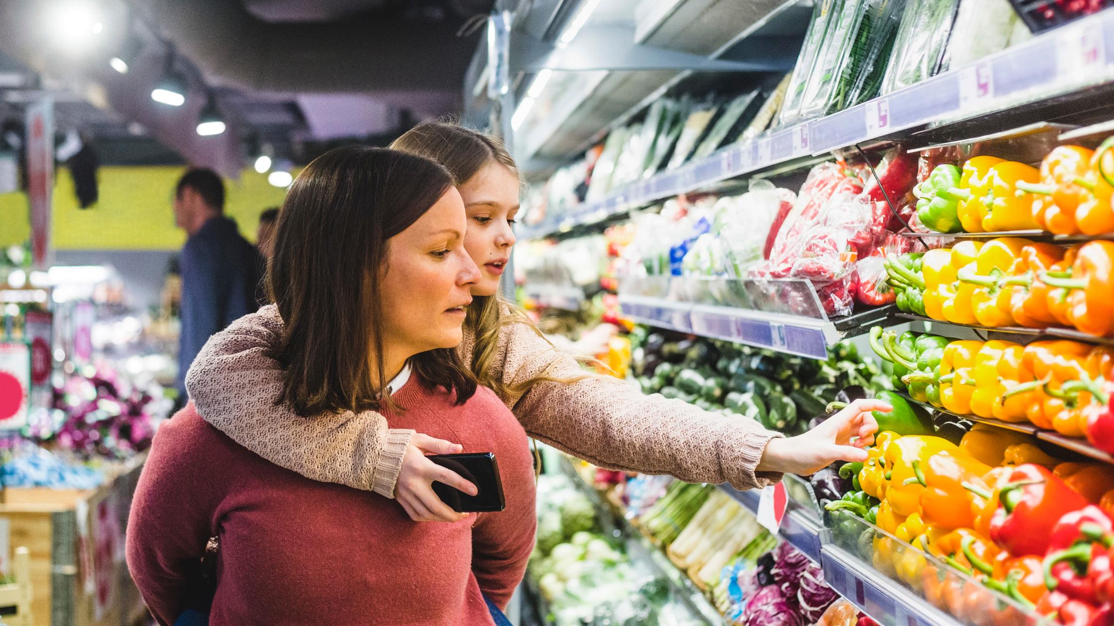 Mother and daughter food shopping