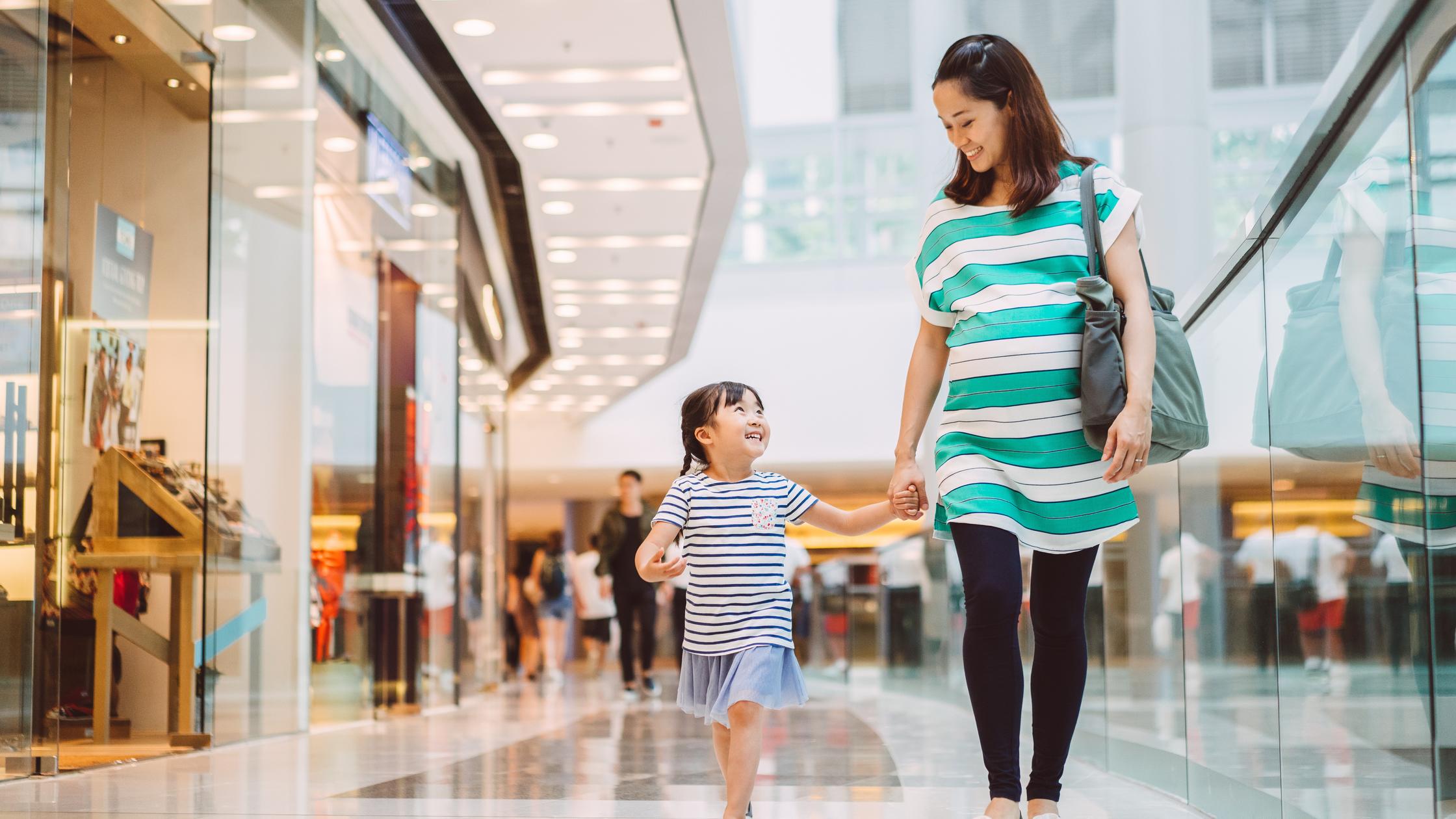 Consumers in the shopping mall joyfully